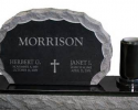 This is an example of a smaller option for a double upright monument with a single vase made from a granite base and jet black material. 