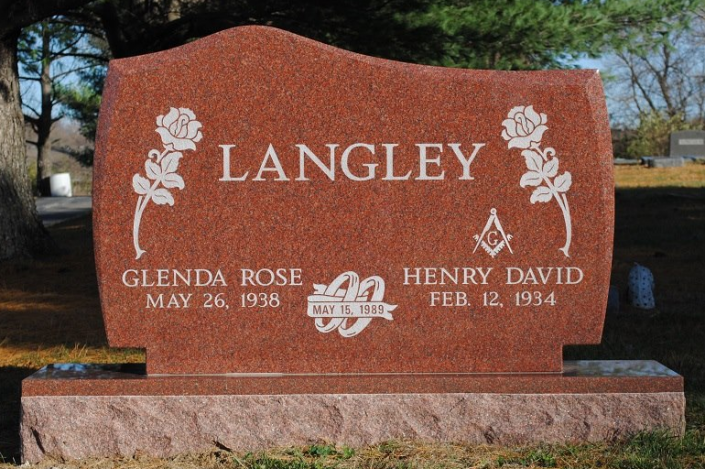Pence Monument Company works with its customers to create an unlimited variety of memorials. This granite upright monument is an example of an option for a double monument with roses and the rings of marriage. 