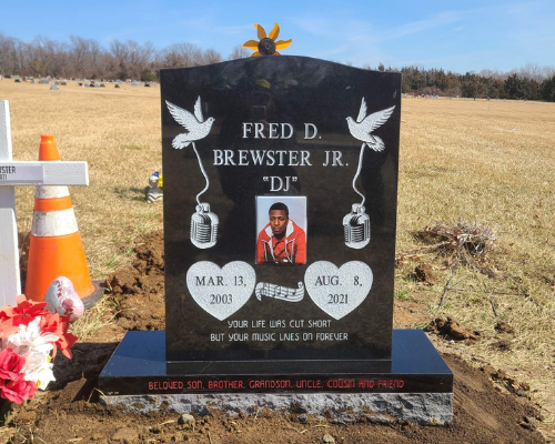 Back headstone with full color photo of deceased and engraved doves