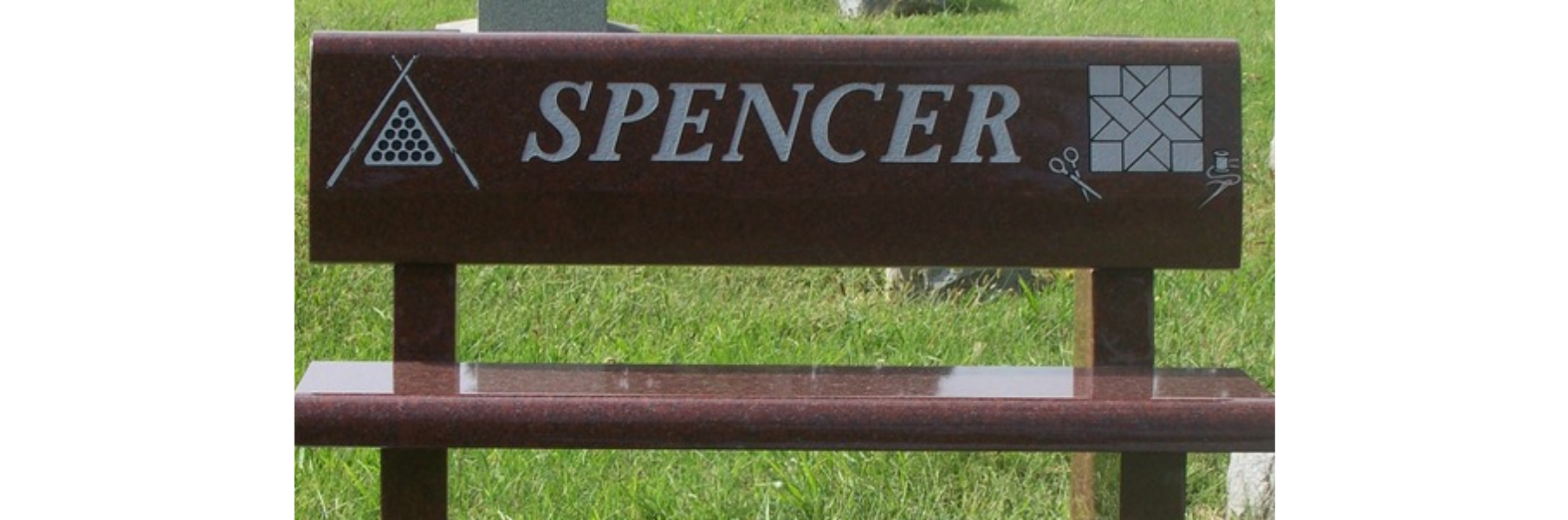 Brown monument bench with the name Spence engraved
