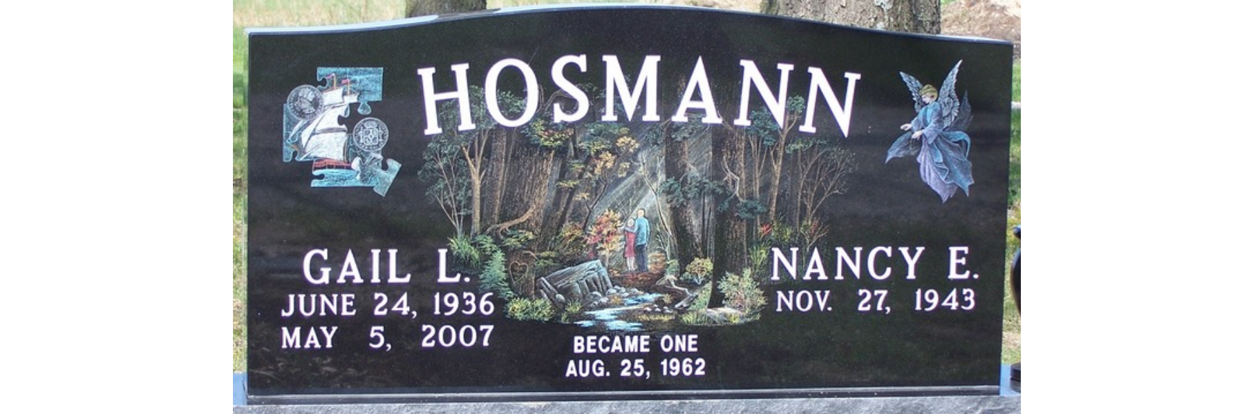Memorial with custom artwork of a woods scene etched into it.